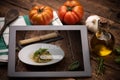 Food recipes tablet computer on rustic wooden table