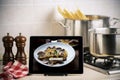 Food recipes tablet computer on rustic wooden table