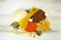 Food: rice, buckwheat, spaghetti, pasta, lentils and garlic with peper on the table