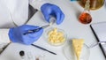 Food saferty Expert inspecting cheese in quality control laboratory Royalty Free Stock Photo