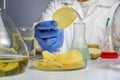 Food safety expert checking potato chips in the laboratory. Close up