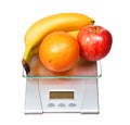 Food scale with fruits apple banana and orange isolated on white Royalty Free Stock Photo