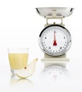 Food scale with pear juice glass isolated on white background Royalty Free Stock Photo