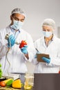 Food scientist using device on pepper Royalty Free Stock Photo