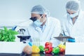 Food scientists using the microscope for research Royalty Free Stock Photo