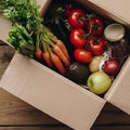 Food selection in paper box: fruit, vegetable, herbs, legumes, cereals, leaf vegetable on wooden background Royalty Free Stock Photo