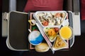 Food served on board of airplane on the table. Royalty Free Stock Photo