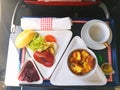 Food served on board of business class airplane on the table Royalty Free Stock Photo