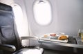 Food served on board of business class airplane on the table Royalty Free Stock Photo