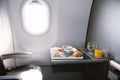 Food served on board of business class airplane on the table Royalty Free Stock Photo