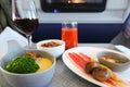 Photo of Food served on board of business class airplane on the table Royalty Free Stock Photo