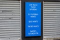 Food served families welcome sign on wall of restaurant Royalty Free Stock Photo