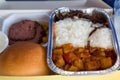 Food served in a passenger aircraft during the flight. Meal on t Royalty Free Stock Photo