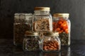 Food set. Raw cereals, pasta, groats, organic legumes and useful seeds in glass jars. Royalty Free Stock Photo