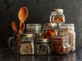 Food set. Raw cereals, pasta, groats, organic legumes and useful seeds in glass jars. Royalty Free Stock Photo