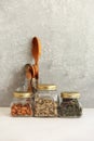 Food set. Raw cereals, pasta, groats, organic legumes and useful seeds in glass jars. Royalty Free Stock Photo