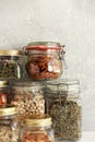 Food set. Raw cereals, pasta, groats, organic legumes and useful seeds in glass jars. Royalty Free Stock Photo