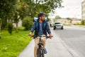 food delivery man with bag riding bicycle Royalty Free Stock Photo