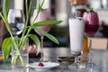 Food shooting. Berry cocktail in crystal glass decorated mint, berries, pomegranate, orange, pineapple. Concept summer drinks,