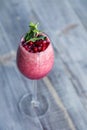 Food shooting. Berry cocktail in crystal glass decorated mint, berries, pomegranate, orange, pineapple. Concept summer drinks,