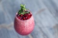 Food shooting. Berry cocktail in crystal glass decorated mint, berries, pomegranate, orange, pineapple. Concept summer drinks, Royalty Free Stock Photo