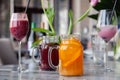 Food shooting. Berry cocktail in crystal glass decorated mint, berries, pomegranate, orange, pineapple. Concept summer drinks,