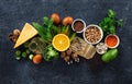 Food sources of omega 3 and healthy fats on dark background top view. Vegetables, seafood, nut and seed Royalty Free Stock Photo