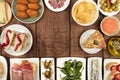 The food of Spain. Overhead photo of many different Spanish tapas with copy space