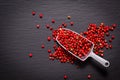 Food Spice concept Organic Pink Peppercorn or pink berry on black background Royalty Free Stock Photo