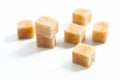 Food Spot focus organic Brown sugar cane cubes on white background Royalty Free Stock Photo