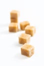 Food Spot focus organic Brown sugar cane cubes on white background Royalty Free Stock Photo