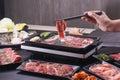 Food stylish prepare raw beef slice and seafood for barbecue japanese style, yakiniku, meat are being cooked on stove Royalty Free Stock Photo