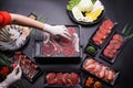 Food stylish prepare raw beef slice and seafood for barbecue japanese style, yakiniku, meat are being cooked on stove Royalty Free Stock Photo