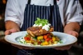 Food stylist decorating meal for trendy restaurant close up of waiter carrying bright plate.