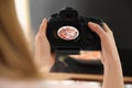 Food stylist taking photo of salad with prosciutto in studio, closeup Royalty Free Stock Photo