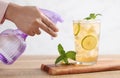 Food stylist use sprayer decorating iced tea with lemon Royalty Free Stock Photo