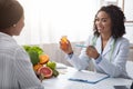 Afro doctor prescribing pills to female patient Royalty Free Stock Photo