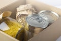 Food supplies during coronavirus quarantine and self-isolation. Food delivery, donation, volunteer support. Cardboard box with Royalty Free Stock Photo