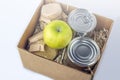 Food supplies during coronavirus quarantine and self-isolation. Food delivery, donation, volunteer support. Cardboard box with Royalty Free Stock Photo