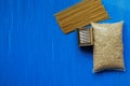 Food supplies crisis food stock for quarantine isolation period. Pasta, cans of canned food, toilet paper. Food donations or food Royalty Free Stock Photo