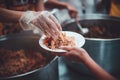 Food support for the poor, homeless hands submitting free food from volunteers