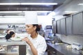 Food that tastes great and looks amazing. a chef putting the final touches on a dinner plate in a professional kitchen. Royalty Free Stock Photo