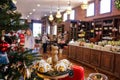 Food themed Christmas tree and display with blurred store and people with bokeh effect Royalty Free Stock Photo