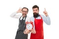 Food time. chef team in apron. Food delivery. fast food. bearded men with alarm clock. lunch time. idea. deadline. cafe Royalty Free Stock Photo