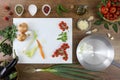 Food top view, cut onion in a frying pan on wooden work top