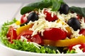 Traditional Bulgarian dish, Shopsky salad, with vegetables and cheese, on a white background, no people, horizontal,