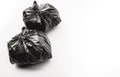 Food trash packing in black plastic bag on color background