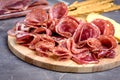 Food Tray With Delicious Salami Pieces of Sliced Ham and Crackers and Bread Sticks Meat Plate Royalty Free Stock Photo