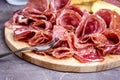 Food Tray With Delicious Salami Pieces of Sliced Ham and Crackers and Bread Sticks Meat Plate Close Up Royalty Free Stock Photo