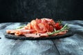 Food tray with delicious salami, pieces of sliced ham, sausage, Royalty Free Stock Photo